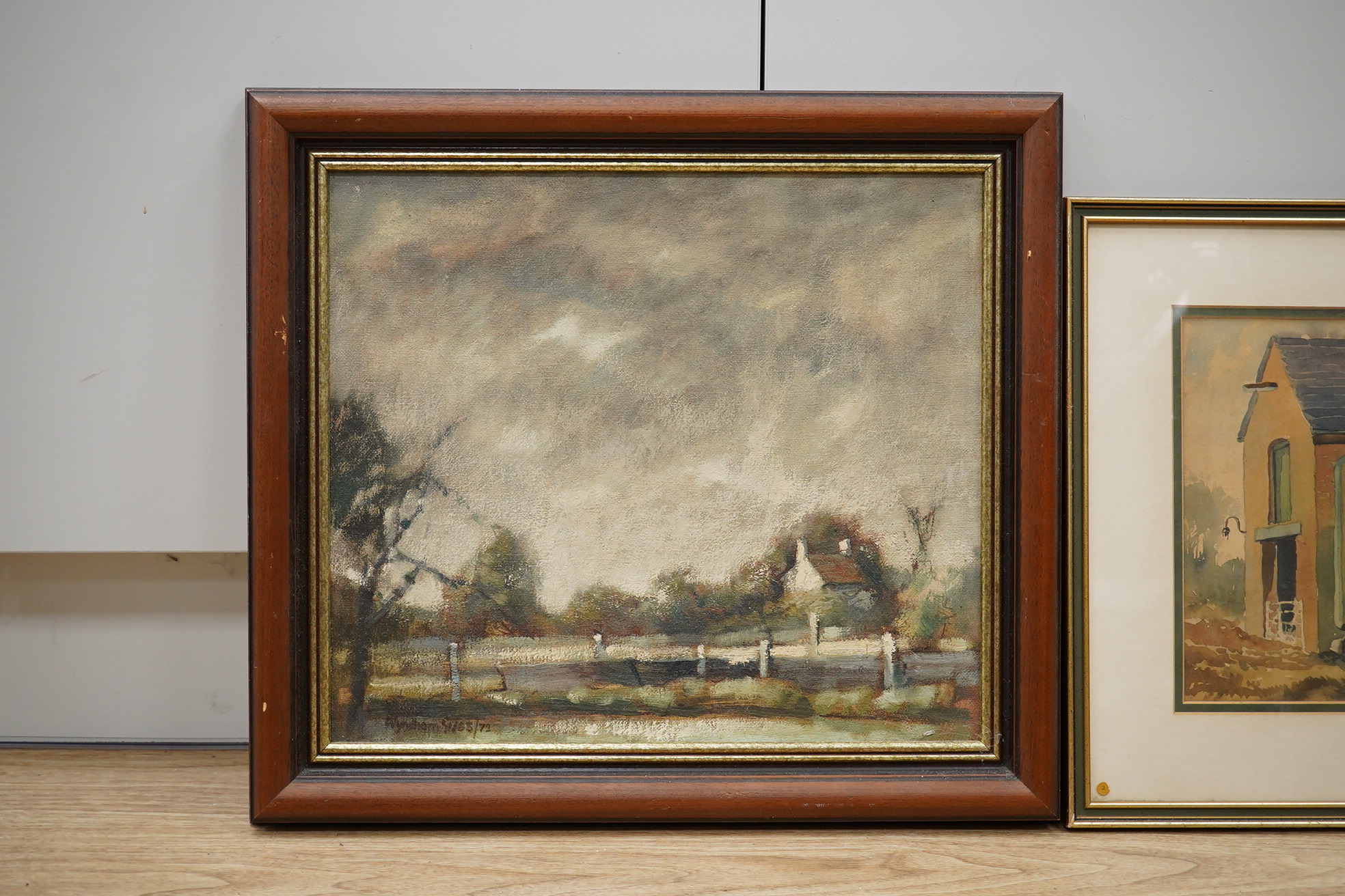 Wyndham Edwin George Giles, an oil on canvas, Stormy landscape, signed and dated ‘72, together with a watercolour by the same artist, ‘Farm Buildings, Staffordshire’, largest 34 x 39cm. Condition - fair to good